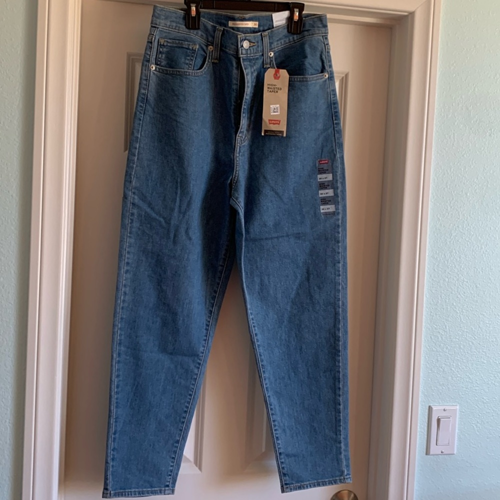Original Levi’s, brand new with tags, size 30, high waisted tapered.